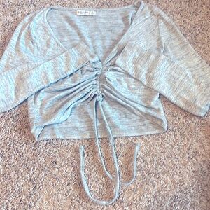 This sexy crop sweater is super comfortable. Ties in the front. Enjoy!